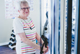 Older woman working out with White and Grey ORA Flex